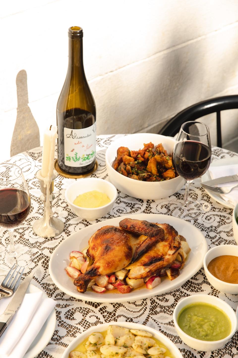 Rustic elegant Sunday Supper served at Lou includes natural red wine, roast chicken and accoutrements.