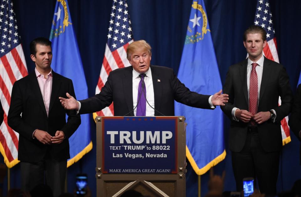 Donald Trump Jr., left, and Eric Trump, right, flanked their father at a 2016 campaign event in Nevada while he ran for the Republican presidential nomination.