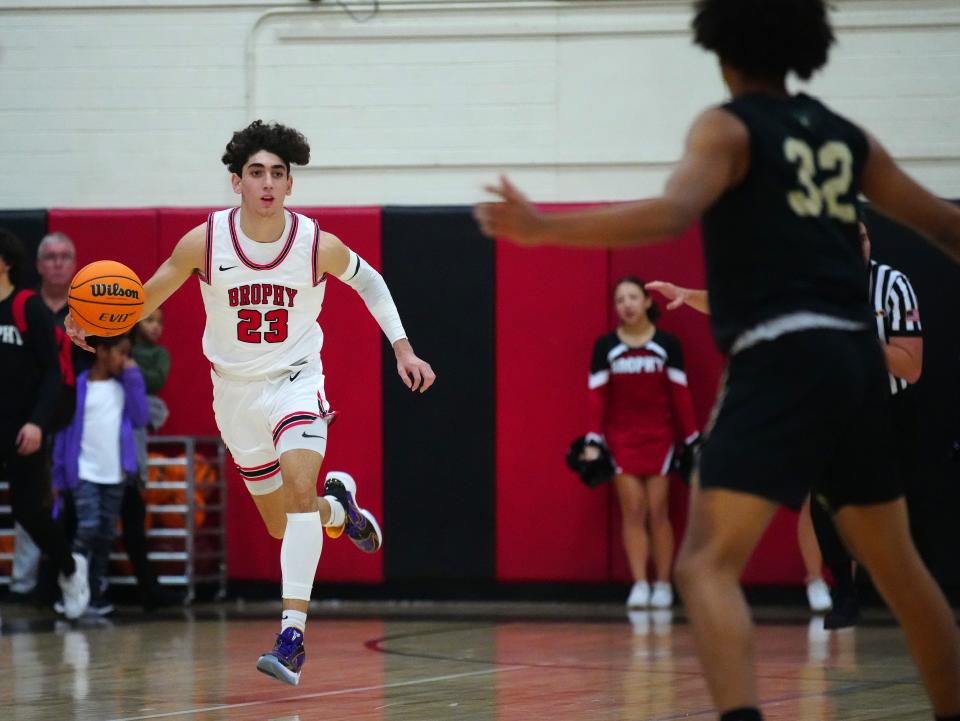 Jan 7, 2022; Phoenix, AZ, United States; Brophy Prep's Arman Madi (23) dribbles up the court against Basha's Christian Warren (32) during a game at Brophy Prep. Mandatory Credit: Patrick Breen- The Republic