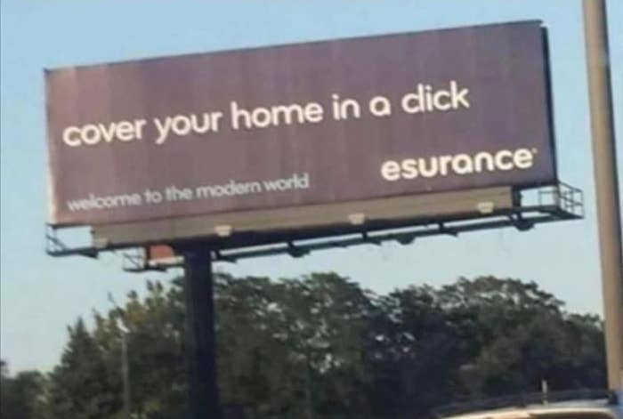 An esurance billboard that appears to read, "cover your home in a dick" instead of "cover your home in a click"