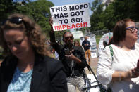 <p>About 300 people rally to protest against President Donald Trump’s firing of Federal Bureau of Investigation Director James Comey outside the White House May 10, 2017 in Washington, DC. Angry over the firing of Comey, the demonstrators demanded that an independent special prosecutor investigate possible ties between the Trump campaign and Russian officials. (Chip Somodevilla/Getty Images) </p>