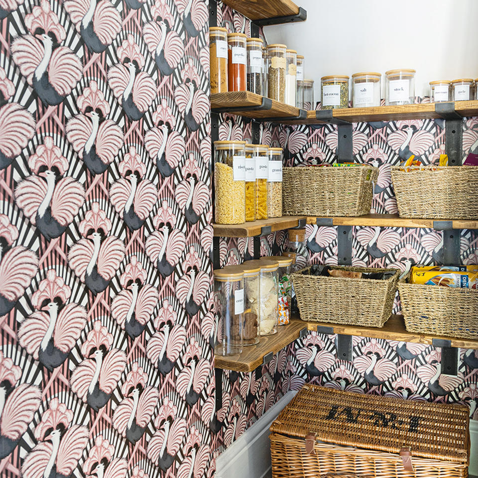 kitchen pantry area with shelves and wallpaper