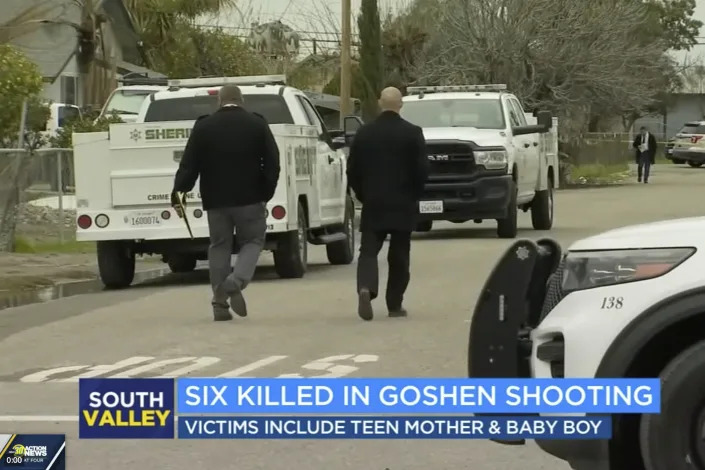 In this image from video provided by ABC30 Action News, investigators work near a home where six people were killed in Goshen, Calif., Monday, Jan. 16, 2023. Authorities are searching for at least two suspects who shot and killed six people including a 17-year-old mother and her 6-month-old baby in what the local sheriff called a "horrific massacre" related to drugs and gangs. (ABC30 Action News)