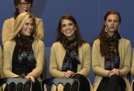 The wives and partners of the U.S. Team (L-R) Dowd Simpson, Annie Verret and Erin Walker watch during the opening ceremony of the 40th Ryder Cup, at Gleneagles in Scotland September 25, 2014. REUTERS/Toby Melville (BRITAIN - Tags: SPORT GOLF ENTERTAINMENT SOCIETY)