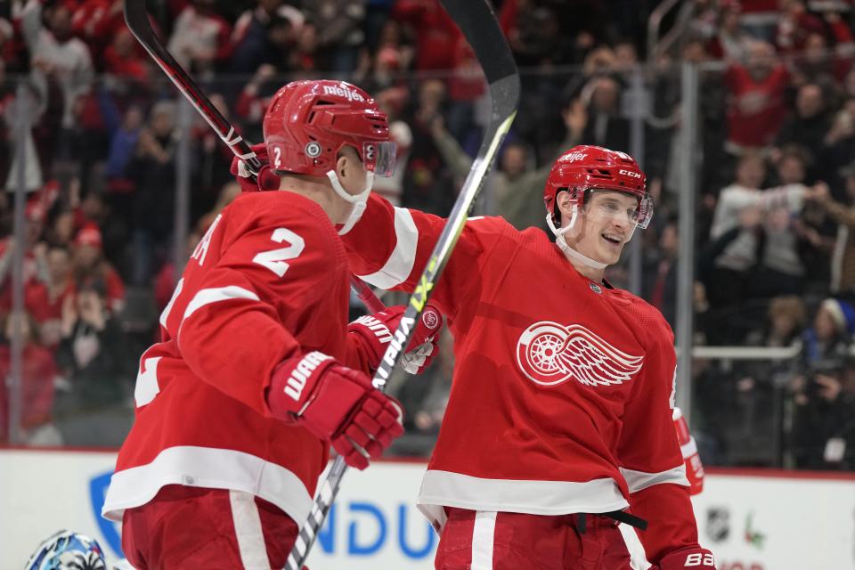 Detroit Red Wings defenseman Olli Maatta (2) is greeted by left wing Dominik Kubalik after scoring during the first period of an NHL hockey game against the Tampa Bay Lightning, Wednesday, Dec. 21, 2022, in Detroit.