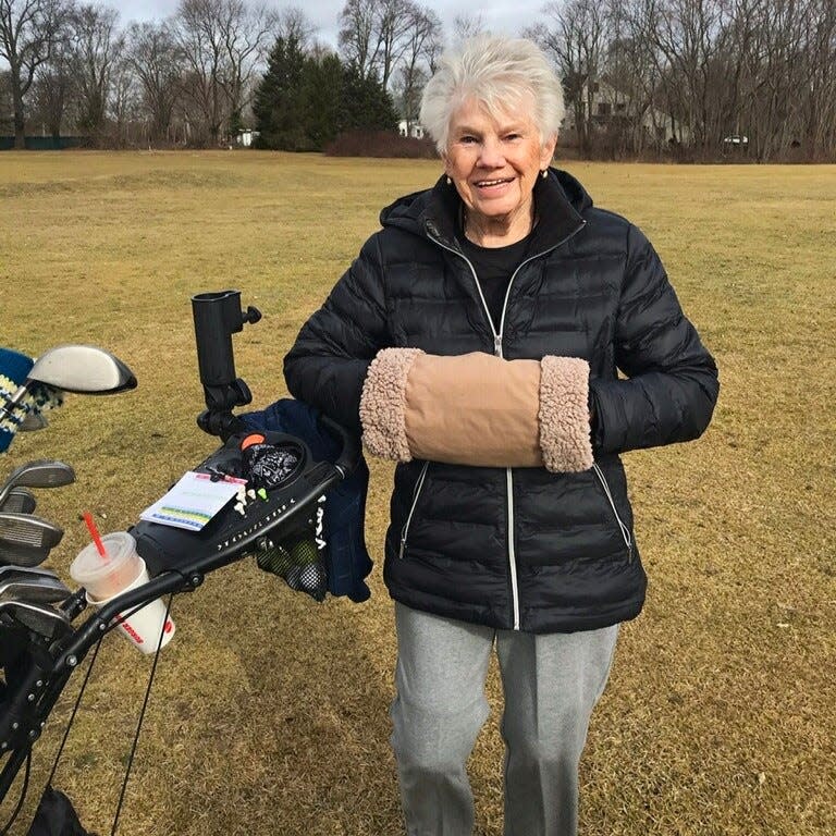 Ellie Boegler of Taunton wears her hand warmers during a round of golf at the John F. Parker Golf Course in December 2023.
