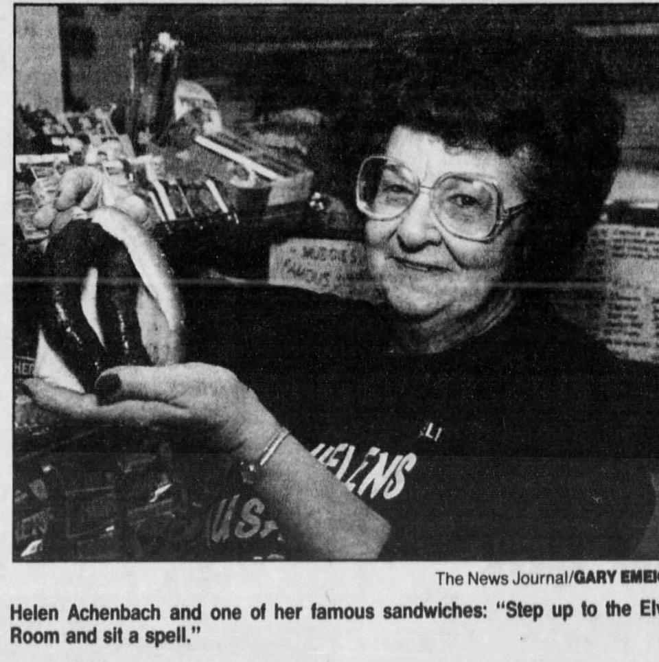 In this 1994 photo, Helen Achenbach, the owner of Helen's Sausage House in Smyrna, holds up one of her famous breakfast sandwiches.