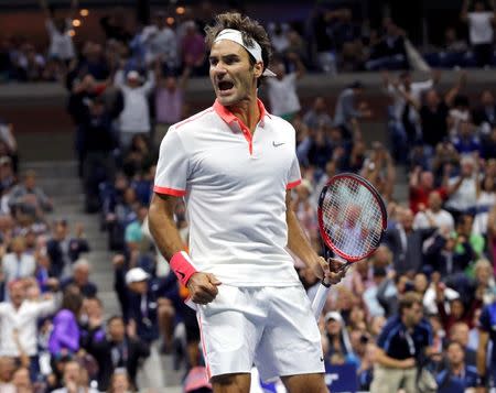 Roger Federer of Switzerland celebrates winning the second set against Novak Djokovic of Serbia during their men's singles final match at the U.S. Open Championships tennis tournament in New York, September 13, 2015. REUTERS/Mike Segar