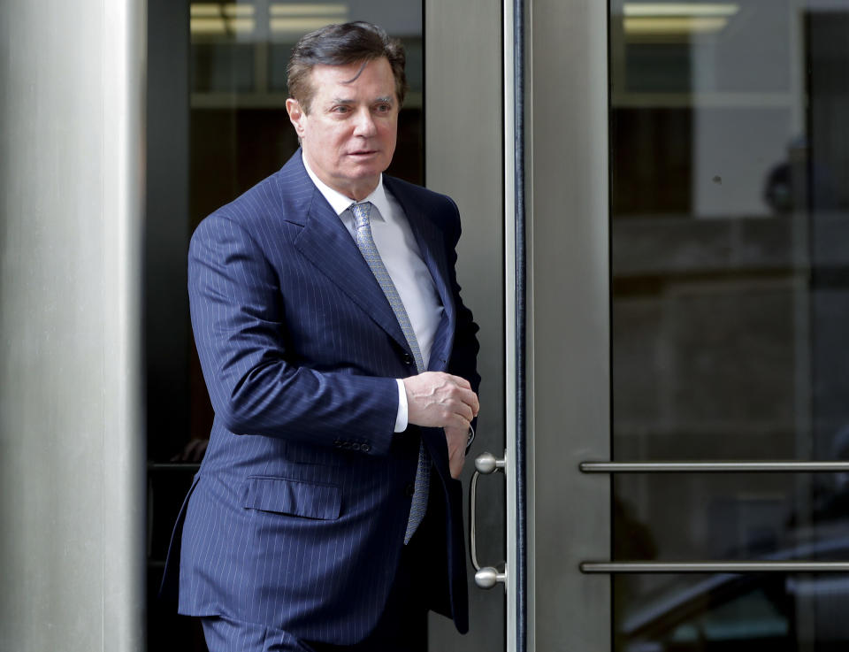 FILE - In this Feb. 14, 2018 file photo, Paul Manafort, President Donald Trump's former campaign chairman, leaves the federal courthouse in Washington. Manafort has been released from federal prison to serve the rest of his sentence in home confinement over concerns about the coronavirus, his lawyer said Wednesday. (AP Photo/Pablo Martinez Monsivais, File)