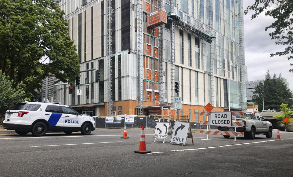 A road closure sign is seen in downtown Portland, Ore., Friday, Aug. 16, 2019, in advance of a rally as the city prepares for crowds. In the past week, authorities in Portland have arrested a half-dozen members of right-wing groups on charges related to violence at previous politically motivated rallies as the liberal city braces for potential clashes between far-right groups and self-described anti-fascists who violently oppose them. (AP Photo/Gillian Flaccus)