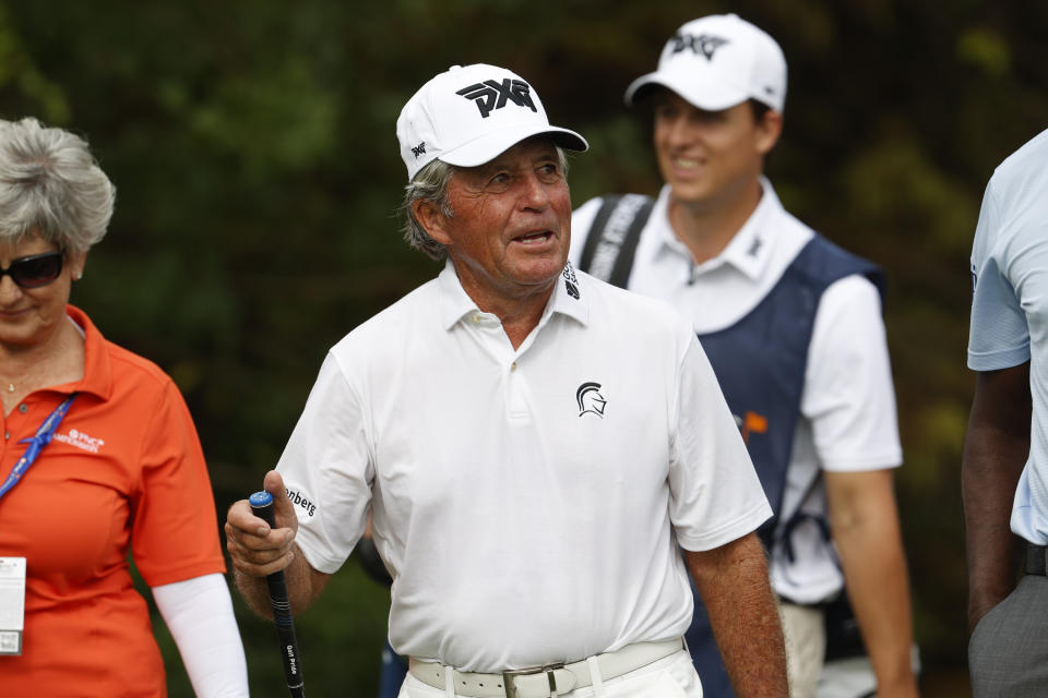 Gary Player walks off the first tee box during the first round of the PNC Championship golf tournament Saturday, Dec. 18, 2021, in Orlando, Fla. (AP Photo/Scott Audette)