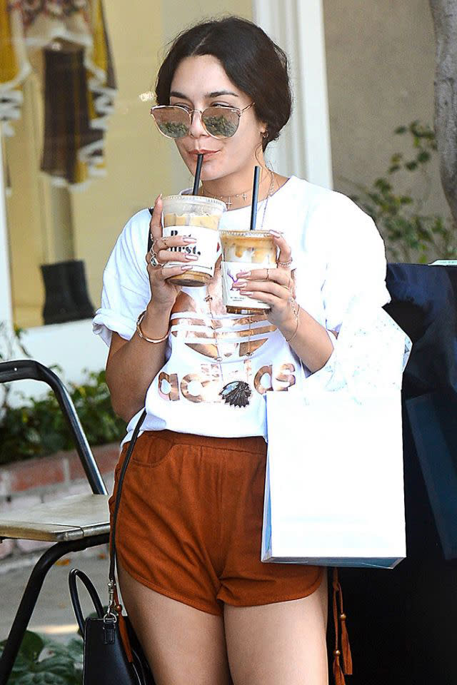 <p>Vanessa double-fisted a couple of iced coffees in La La Land. So <em>that’s</em> her secret to staying so perky! (Photo: AKM-GSI) </p>