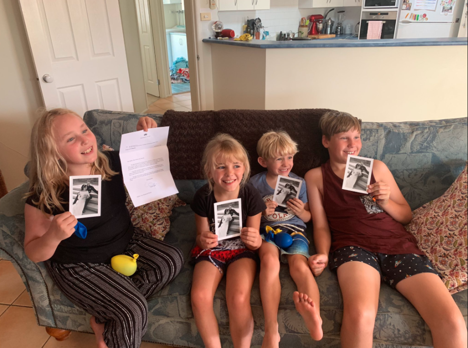 Kelwyn showed a picture of the kids holding up the letter and their photos of Meghan Markle and Prince Harry, with massive grins on their faces. Photo: Twitter/Kelwyn White