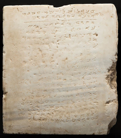 A stone tablet thought to be about 1,500 years old with a, worn-down chiseled inscription of the Ten Commandments is seen in this photo released in Dallas, Texas, U.S., October 21, 2016. Courtesy Heritage Auctions/Handout via REUTERS