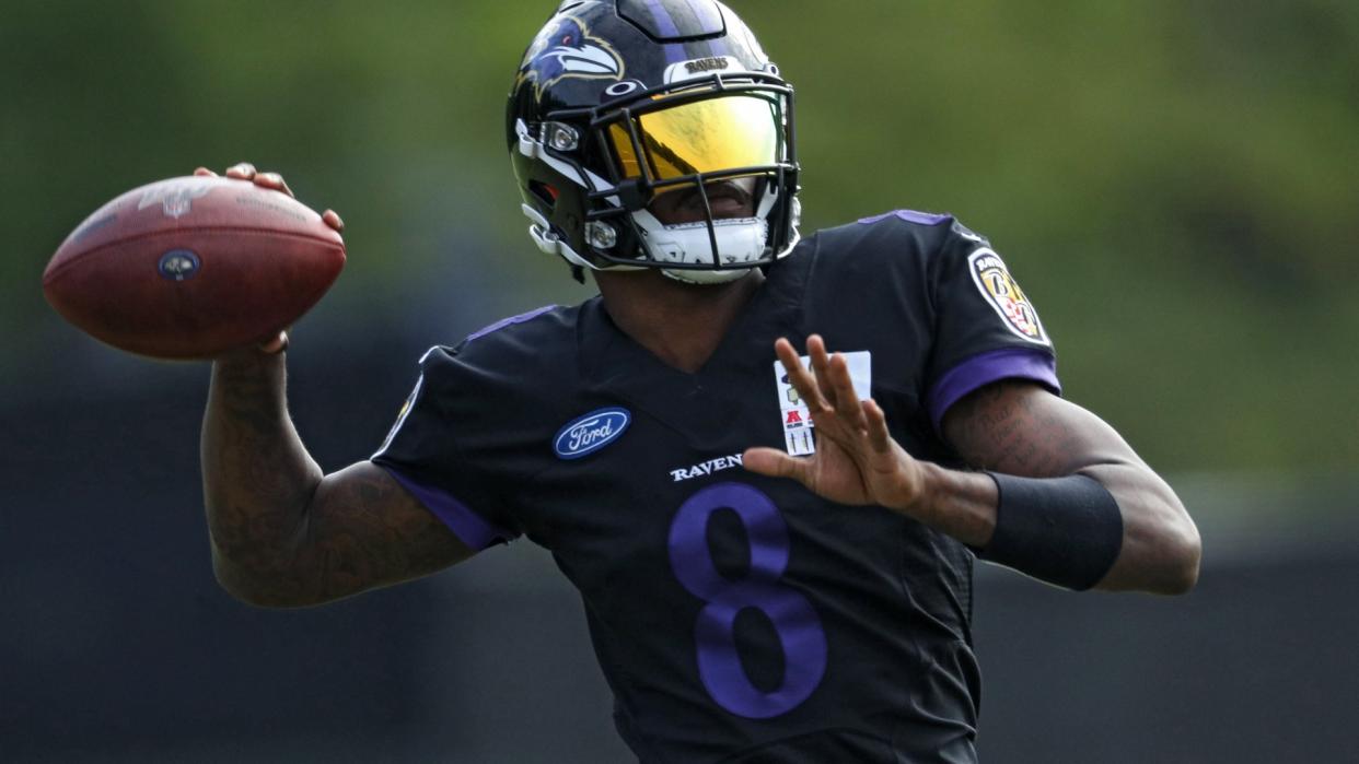 OWINGS MILLS, MARYLAND - AUGUST 17: Quarterback Lamar Jackson #8 of the Baltimore Ravens throws a pass during the Baltimore Ravens Training Camp at Under Armour Performance Center Baltimore Ravens on August 17, 2020 in Owings Mills, Maryland.