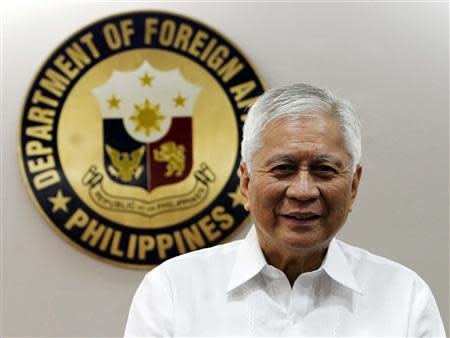 Philippine Foreign Affairs Secretary Albert Del Rosario poses for a picture before the start of a Reuters interview at the Department of Foreign Affairs headquarters in Manila September 4, 2013. REUTERS/Romeo Ranoco