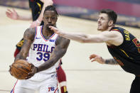 Philadelphia 76ers' Dwight Howard (39) grabs a rebound against Cleveland Cavaliers' Isaiah Hartenstein (55) in the first half of an NBA basketball game, Thursday, April 1, 2021, in Cleveland. (AP Photo/Ron Schwane)