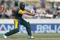 South Africa's Hashim Amla hits a boundary during the Cricket World Cup match against Ireland at Manuka Oval in Canberra March 3, 2015. REUTERS/Jason Reed