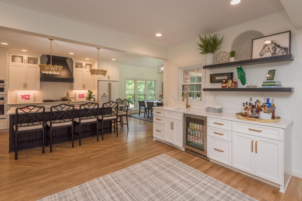 A bar sits off to the side of the kitchen in this colonial-style home in the Bridgepointe neighborhood of Prospect that was built in 1988. It will be featured on the 2022 Tour of Remodeled Homes in Louisville.