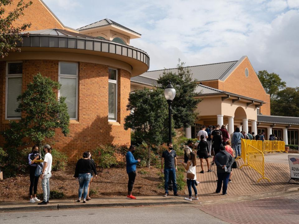 People wait outside Smyrna Community Center,