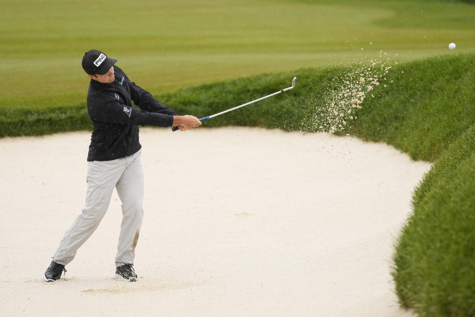 Viktor Hovland, of Norway, hits from the bunker on the fourth hole during the third round of the PGA Championship golf tournament at Oak Hill Country Club on Saturday, May 20, 2023, in Pittsford, N.Y. (AP Photo/Seth Wenig)