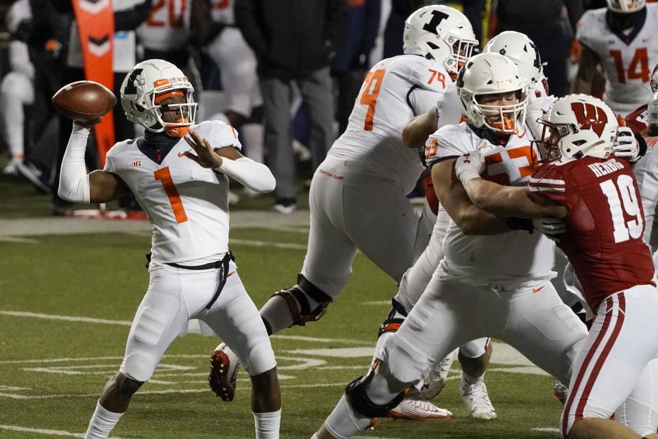 Illinois quarterback Isaiah Williams throws a pass during the second half of an NCAA college football game against Wisconsin Friday, Oct. 23, 2020, in Madison, Wis. Wisconsin won 45-7. (AP Photo/Morry Gash)