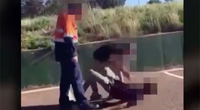 Video shows the father confronting a teenager who had allegedly spat at his daughter. Source: 7 News