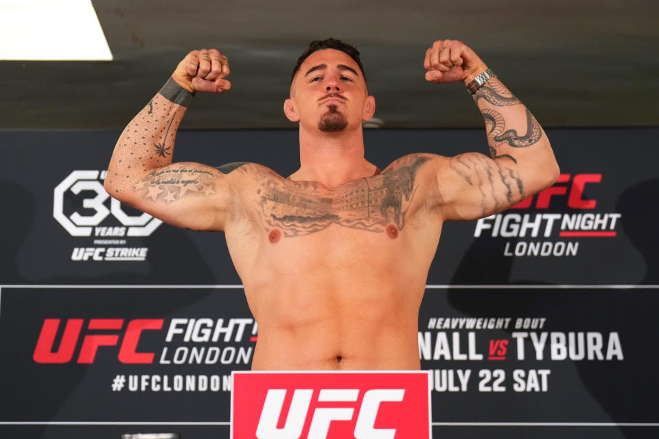 LONDON, ENGLAND - JULY 21:  Tom Aspinall of England poses on the scale during the UFC Fight Night weigh-in at Hilton London Canary Wharf on July 21, 2023 in London, England. (Photo by Chris Unger/Zuffa LLC via Getty Images)