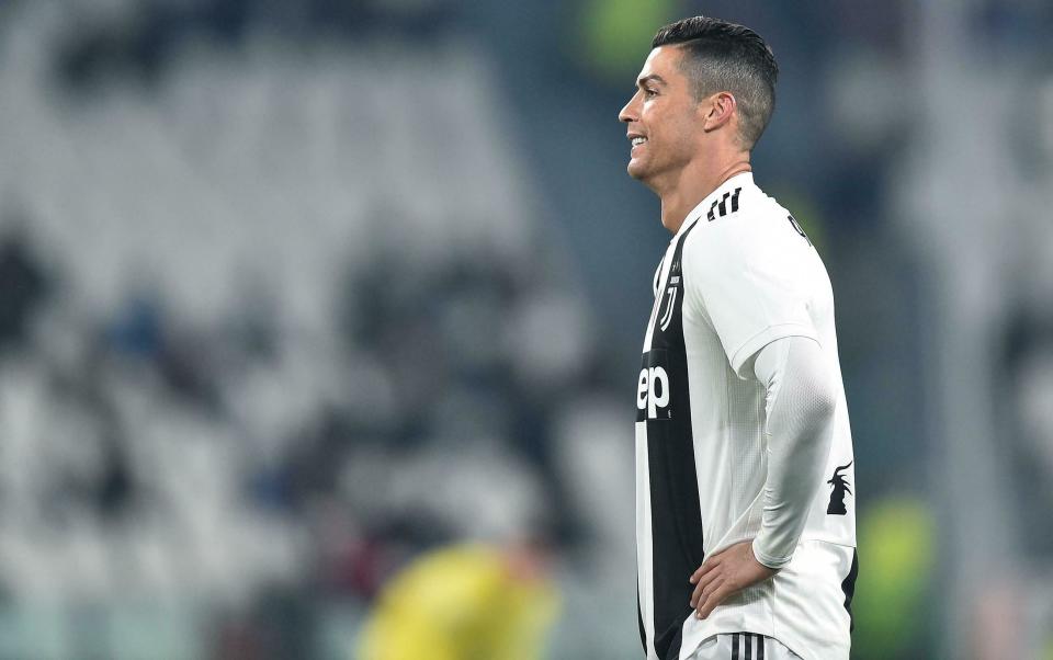 Juventus' Cristiano Ronaldo reacts during the match against AC Chievo Verona, during their Italian Serie A soccer match Juventus FC vs AC Chievo Verona at Allianz stadium in Turin, Italy, Monday Jan. 21, 2019. (Alessandro Di Marco/ANSA via AP)