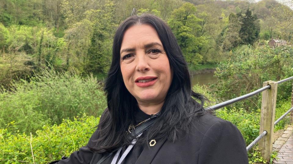 Councillor standing in front of the River Severn