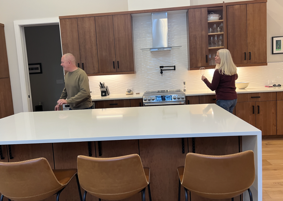 Martha and Ken Williams in their new kitchen in the new net-zero Array development in Orange County.