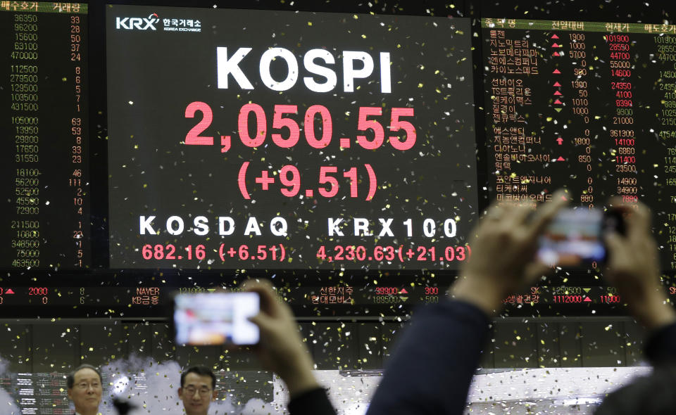 A huge screen shows the Korea Composite Stock Price Index (KOSPI) during the opening of the 2019 trading year at the Korea Exchange in Seoul, South Korea, Wednesday, Jan. 2, 2019. (AP Photo/Lee Jin-man)