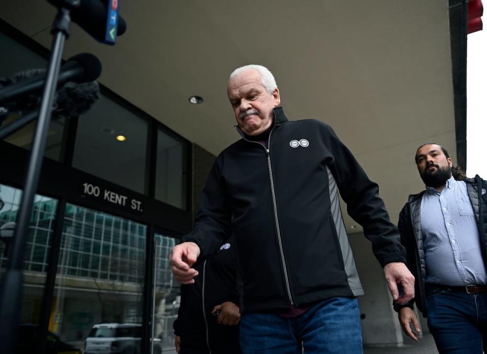 Chris Aylward, national president of the Public Service Alliance of Canada (PSAC), leaves a news conference on April 22, 2023 in Ottawa.