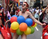 <p>People take part in the annual 2018 New York City Pride Parade on June 24, 2018 as they make their way down 7th Avenue in New York. (Photo: Timothy A. Clary/AFP/Getty Images) </p>