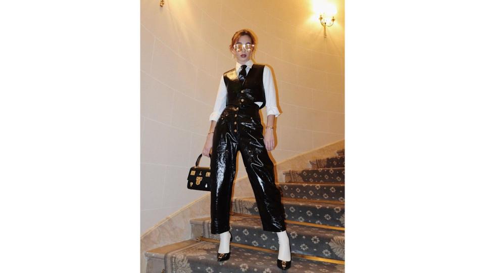 Emma Chamberlain donned a patent leather option to the Schiaparelli show