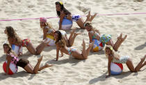 Dancers perform at the Beach Volleyball Venue at the 2012 Summer Olympics, Saturday, July 28, 2012, in London. (AP Photo/Dave Martin)