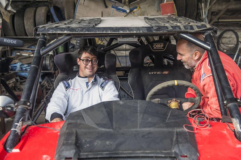 <p>Lucas Barron and his father Jacques Barron work on their car while preparing for the 2019 Rally Dakar race in Peru on December 18. 2018. Lucas made history as the first person with Down Syndrome to compete in the grueling 10-day race. </p>