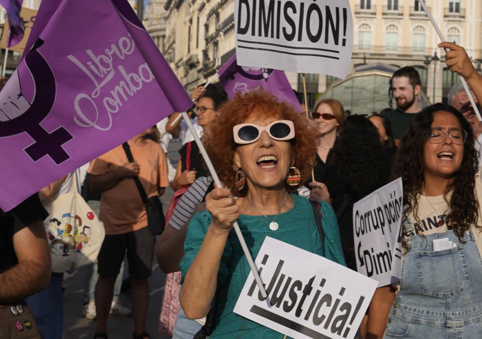 People shout slogans during a protest against the Spanish soccer federation president Luis Rubiales in Madrid, Spain, Friday, Sept. 1, 2023. A Spanish government legal panel is opening a case against suspended soccer chief Luis Rubiales who has come in for a storm of criticism and calls for his resignation for kissing a player on the lips without consent after Spain won the recent Women's World Cup final in Sydney. Placards read 'Justice', Corruption, Resign'. (AP Photo/Paul White)