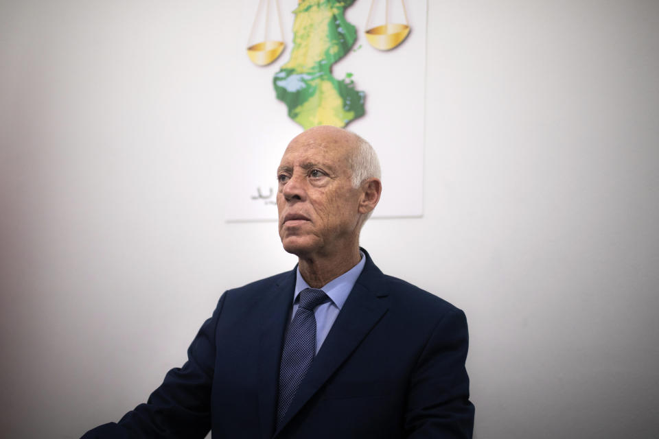 Tunisian former conservative constitutional law professor Kais Saied poses in his office in Tunis, Tunisia, Tuesday, Sept. 17, 2019. With more than half the votes in Tunisia's presidential race counted, Kais Saied was in the lead. Media magnate Nabil Karoui, a more modernizing candidate, was in second place with 15.5%. (AP Photo/Mosa'ab Elshamy)