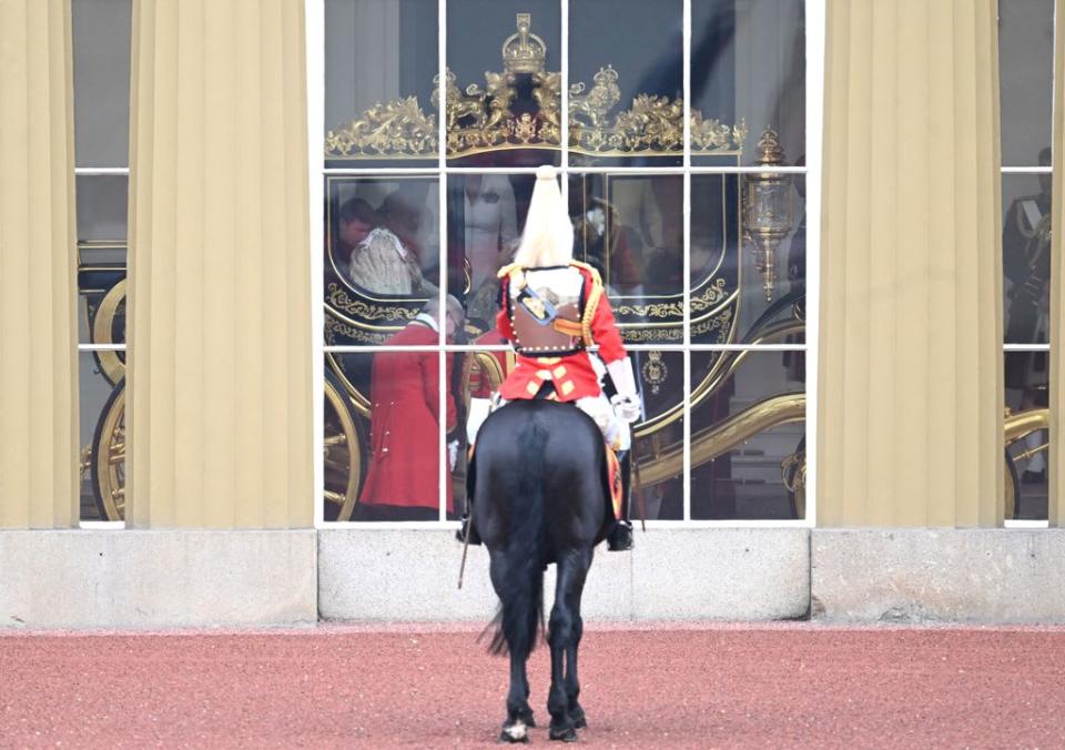 King Charles III travelling in the Diamond Jubilee Coach built in 2012 to commemorate the 60th anniversary of the reign of Queen Elizabeth II at Buckingham Palace ahead of the Coronation