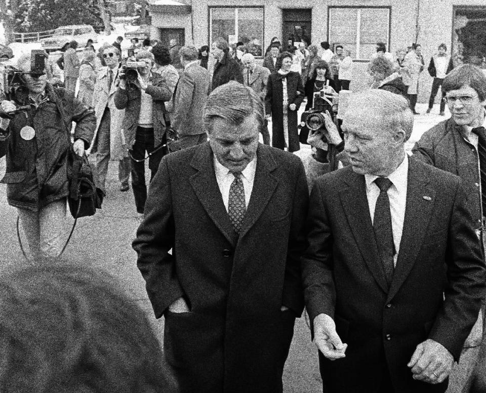 FILE - In a Monday, Feb. 21, 1983 file photo, Democratic presidential candidate Walter Mondale, left, leaves a food shelf store in Gilbert, Minnesota, with U.S. Rep. Jim Oberstar, D-Minn. Former U.S. Rep. Jim Oberstar, who served northeastern Minnesota for 36 years, died in his sleep Saturday, May 3, 2014, according to a statement from his family. He was 79. (AP Photo/Jim Mone, File)