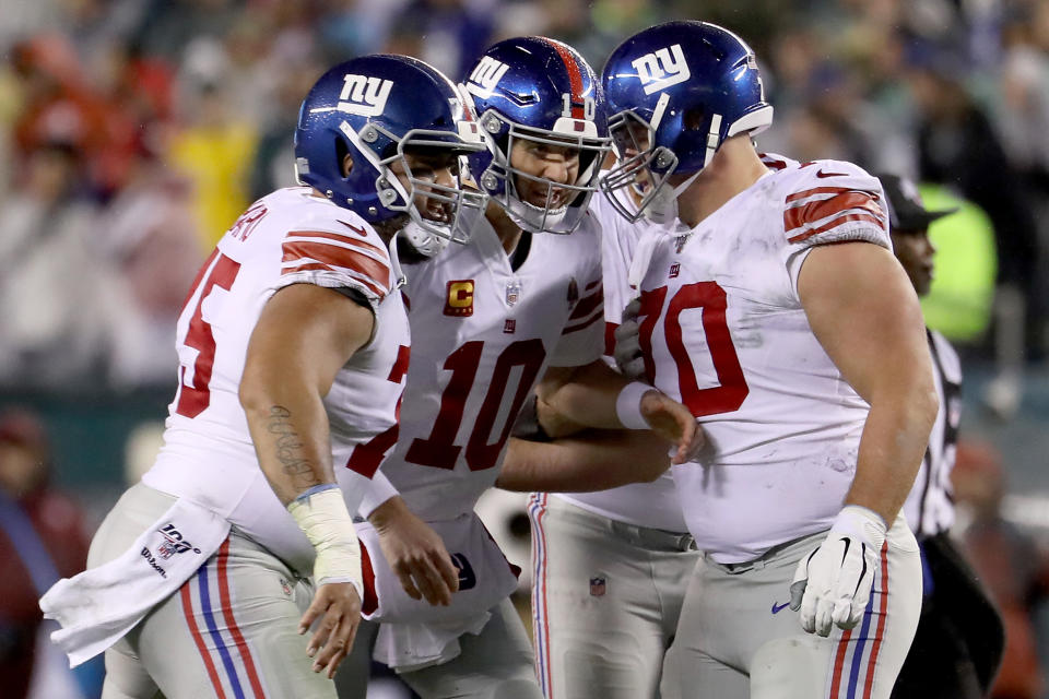 Giants quarterback Eli Manning celebrates with teammates after a touchdown pass to wide receiver Darius Slayton. (Photo by Al Bello/Getty Images)