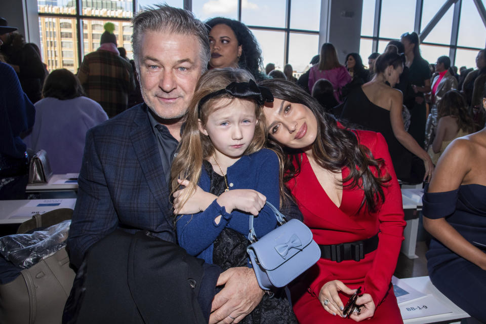 Alec Baldwin, from left, Carmen Baldwin and Hilaria Baldwin attend the Badgley Mischka fashion show at Spring Studios during NYFW Fall/Winter 2020 on Saturday, Feb. 8, 2020, in New York. (Photo by Charles Sykes/Invision/AP)