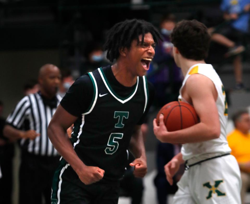 Trinity’s Cam McClain celebrates scoring against St. X.Jan. 11, 2022