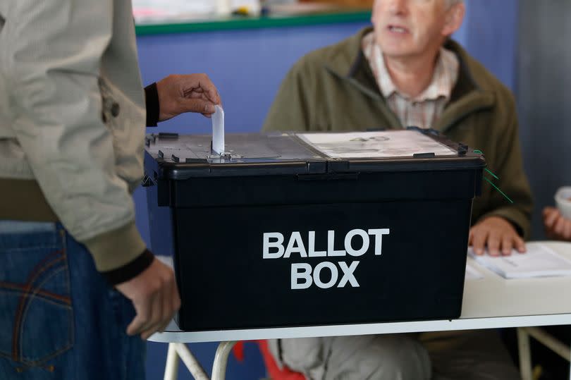 A voter casts their ballot