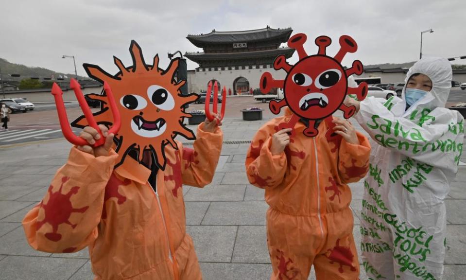 Covid-19 masks at an Earth Day event in Seoul, South Korea, linking ecosystem destruction to the root causes of the coronavirus pandemic.