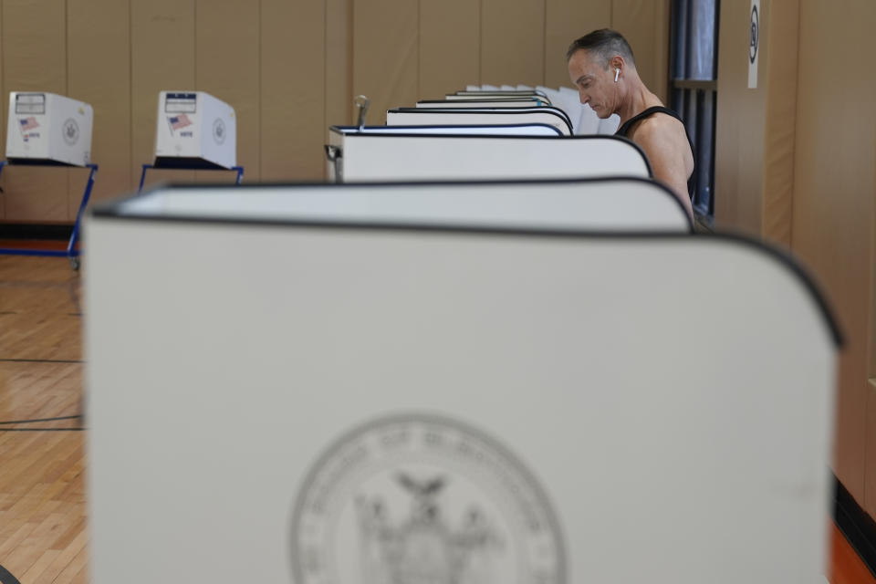 Ed Hummel fills out his ballot at a polling site in Manhattan, New York, Tuesday, April 2, 2024. New York is among four states casting their ballots in the 2024 presidential primary; both President Joe Biden and former President Donald Trump already have enough delegates to secure their parties' nominations. (AP Photo/Seth Wenig)