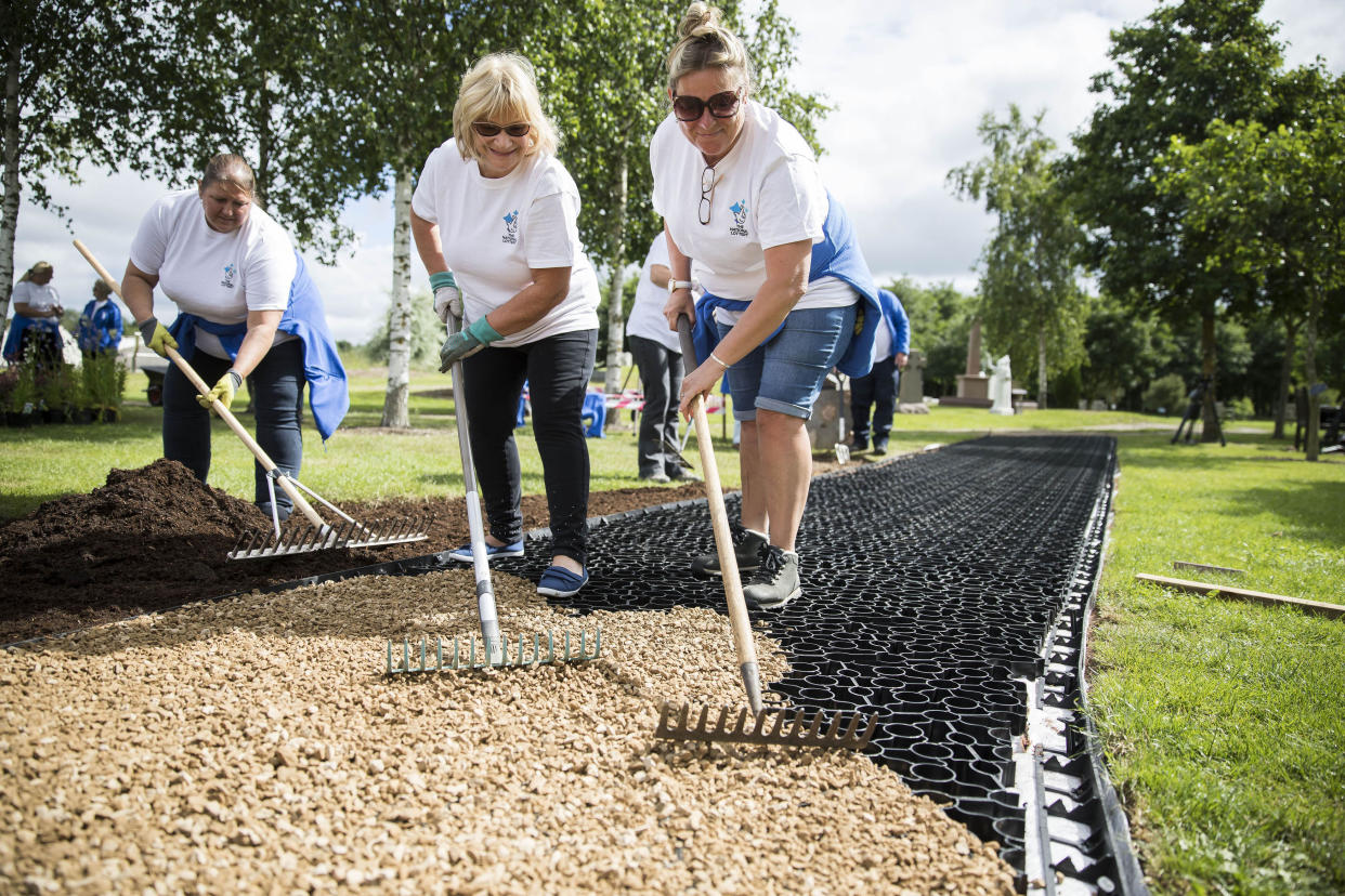 Volunteers build a new walkway and garden at The National Memorial Arboretum in Staffordshire. Photo: Fabio De Paola/PA Archive/PA Images