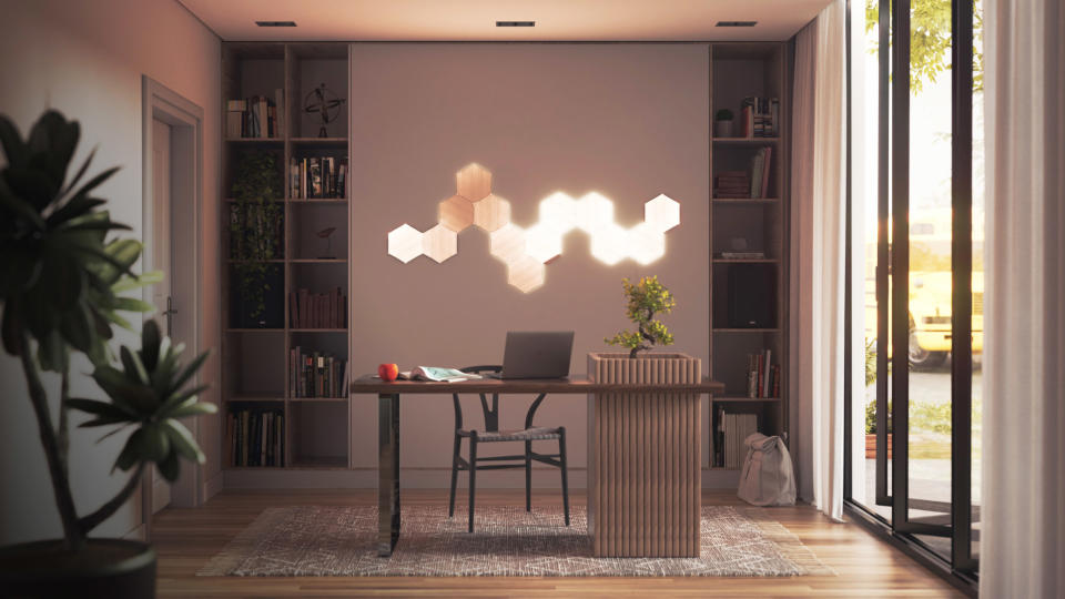 Nanoleaf Elements light panels illuminated on the wall of a study