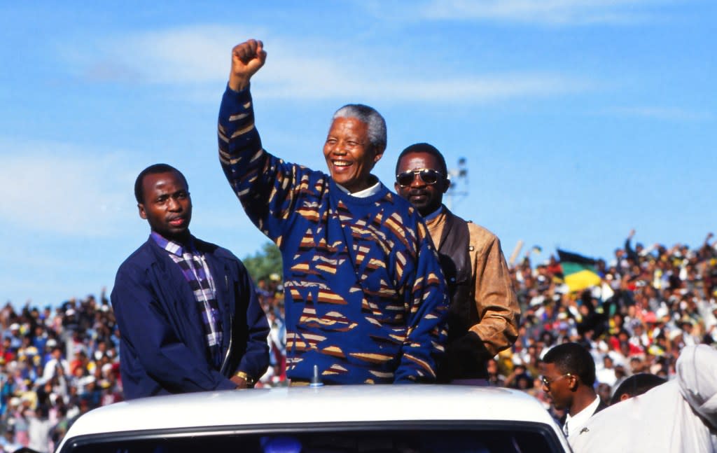 Nelson Mandela (center) campaigns during the first democratic election, Cape Town, South Africa, 1995. (Photo by Susan Winters Cook/Getty Images)